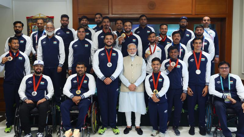 Yogesh Kathuniya (centre) alongside PM Modi. Yogesh Kathuniya (centre) alongside PM Modi.