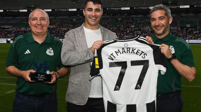 Team Newcastle United with Agustin Bilinskis (centre) of VT Markets 
