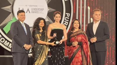 Ananya Panday receiving the award at the 11th IAA Leadership Awards