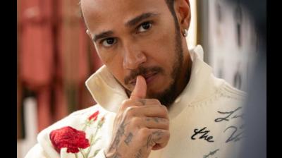 LVMH flagship Louis Vuitton frequently dresses Hamilton for his now famous 'paddock walks' before races